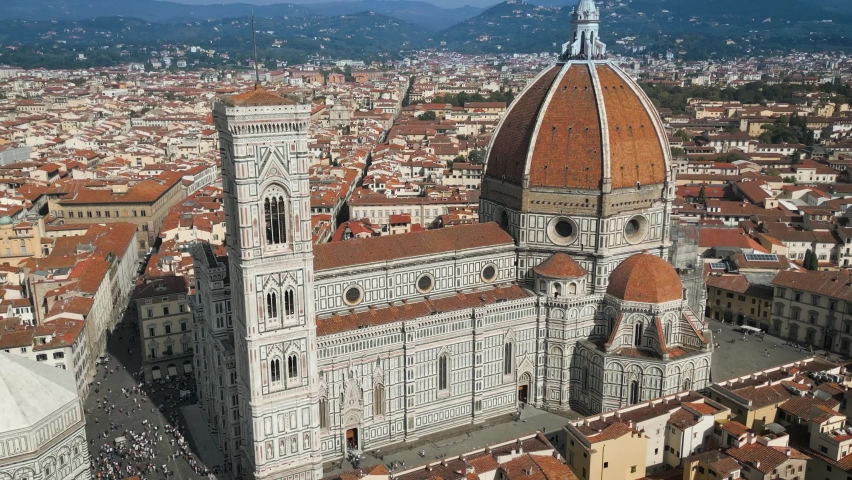 Air close View of the Florence Cathedral, Cattedrale di Santa Maria del Fiore in Firenze, Florence, Italy on a sunny day
 Royalty-Free Stock Footage #1097533729