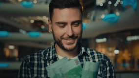 Millennial businessman rich latino man counting euro banknotes exchange currency at business center male win money prize paying cash in shopping mall. Concept of investment success financial prospects - Powered by Shutterstock - Get 15% off with code: PIKWIZARD15