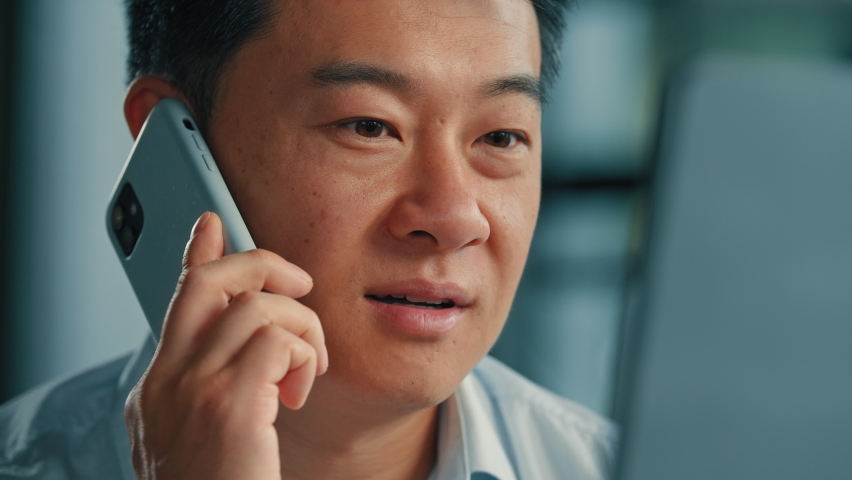Asian korean chinese man 40s businessman mature boss agent consultant male office worker calling client speak mobile phone business conversation on cellphone consulting online wireless 5g connection | Shutterstock HD Video #1097538273
