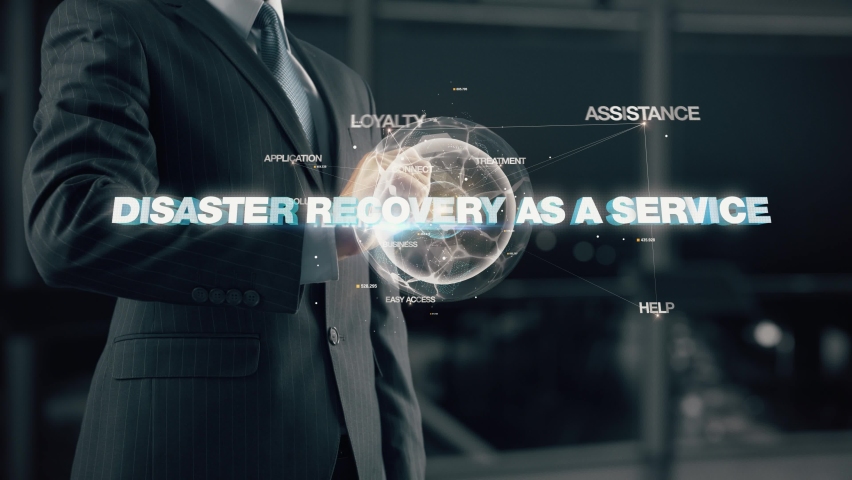Businessman with Disaster Recovery As A Service hologram concept