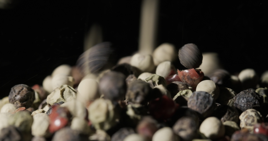 Peppercorns fall into a pile. slow motion video | Shutterstock HD Video #1097553733
