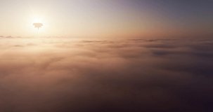 Beautiful sunrise over sea of fog Drone view mover over cloud texture