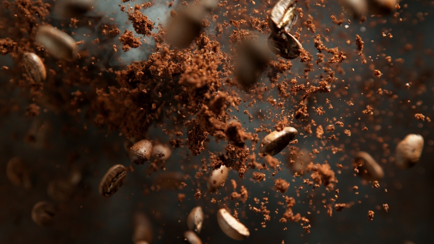 Super Slow Motion Shot of Ground Coffee and Fresh Beans Explosion Towards Camera at 1000fps.