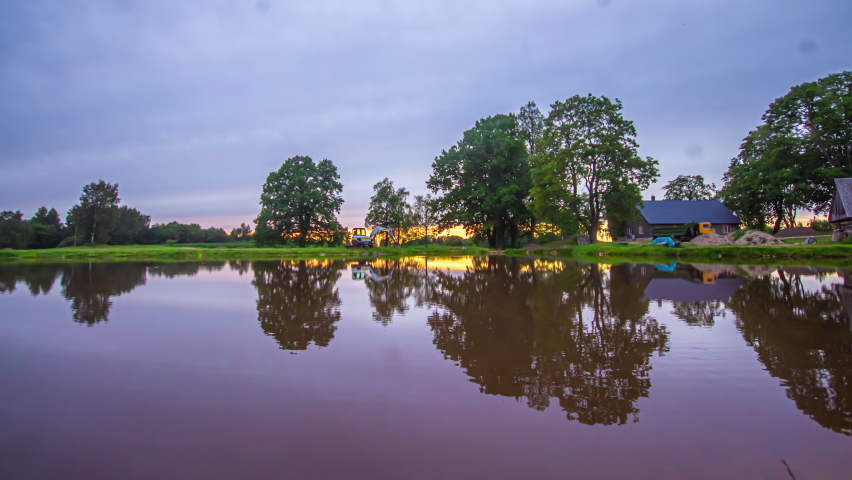 Majestic Sunset Timelapse Of Over Lake With Pink, Purple Cloudscape Skies. Static Shot
