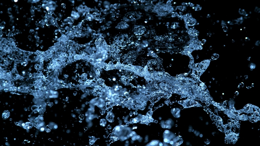 Super slow motion of splashing water isolated on black background. Filmed on high speed cinema camera, 1000fps. Speed ramp effect. | Shutterstock HD Video #1097573543