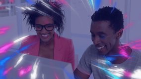 Animation of digital waves over african american male and female colleagues using computer at office. Computer interface and business technology concept - Powered by Shutterstock - Get 15% off with code: PIKWIZARD15