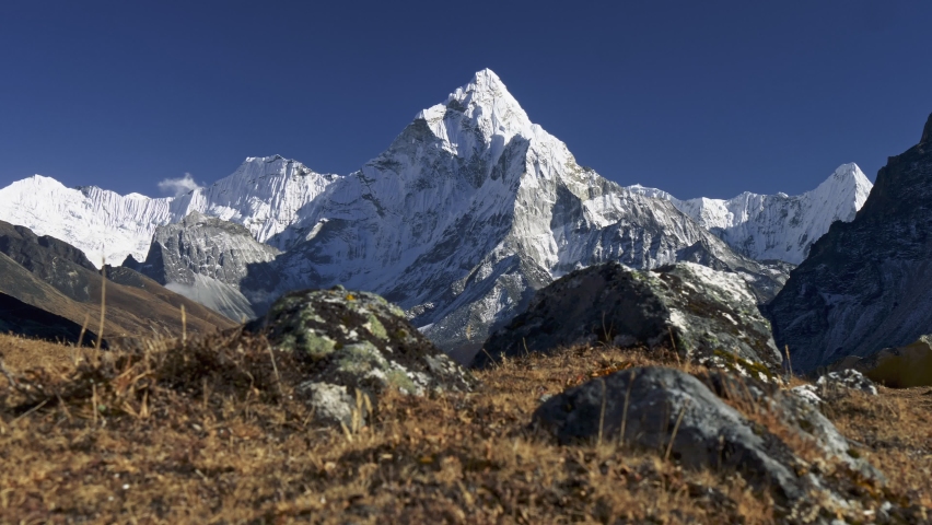 Gimbal shot of Mount Ama Dablam. Himalaya, Nepal. View from Trek to the Everest Base Camp. Crane shot, 4K Royalty-Free Stock Footage #1097581451