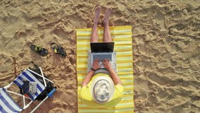 Freelancer working on the beach near the sea waves. Businessman on vacation in a tropical paradise. Remote work. 4G, 5G connection background - Powered by Shutterstock - Get 15% off with code: PIKWIZARD15