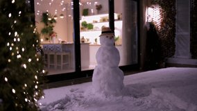 modern aparment decorated to Christmas holidays with snowman and fluffy snow on patio - Powered by Shutterstock - Get 15% off with code: PIKWIZARD15