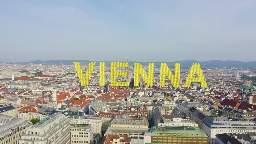 Inscription on video. Vienna, Austria. St. Stephen's Cathedral (Germany: Stephansdom). Catholic Cathedral - the national symbol of Austria. Knitted texture inscription, Aerial View | Shutterstock HD Video #1097592013