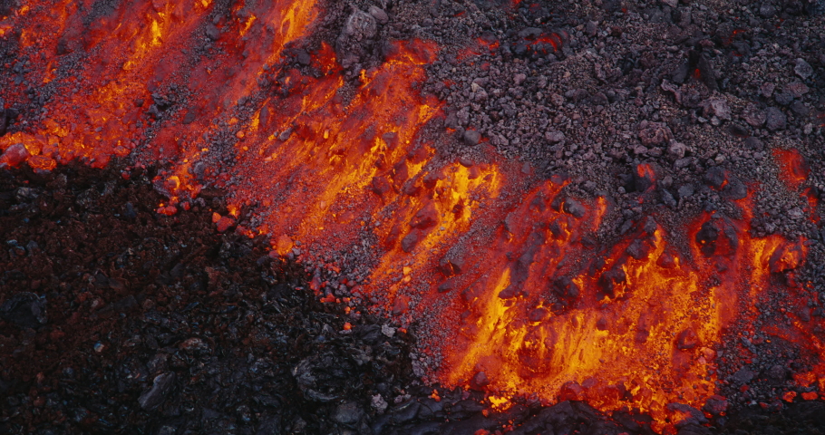 Lava flow from the Hawaii Mauna Loa volcano eruption of 2022, Hot lava and magma flowing down the mountain, Shot on RED Royalty-Free Stock Footage #1097592215