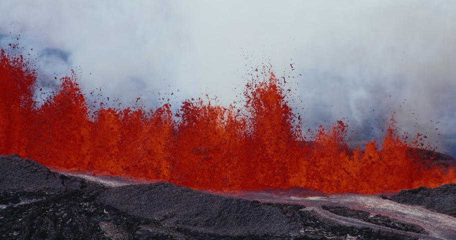 Volcano erupting, lava fountain shooting up into the air from the Hawaii Mauna Loa volcano eruption of 2022, Shot on RED Royalty-Free Stock Footage #1097592265