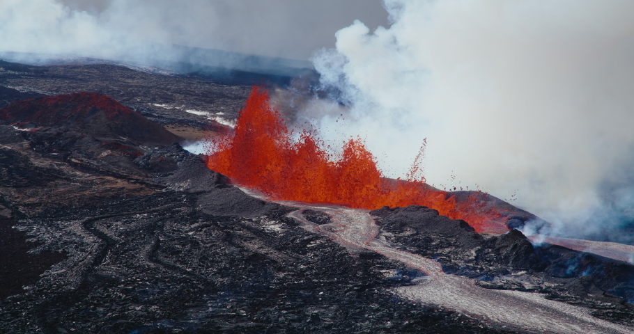 Aerial view of the Hawaii Mauna Loa volcano eruption of 2022, Hot lava and magma erupting out of the volcano in slow motion, Shot on RED Royalty-Free Stock Footage #1097592275