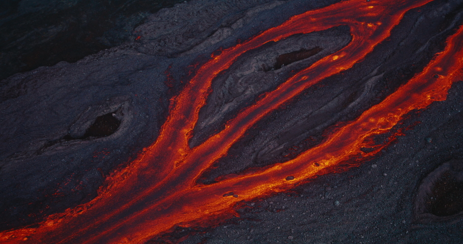 Aerial view of river of red hot molten lava flowing from the Hawaii Mauna Loa volcano eruption of 2022, Shot on RED Royalty-Free Stock Footage #1097592277