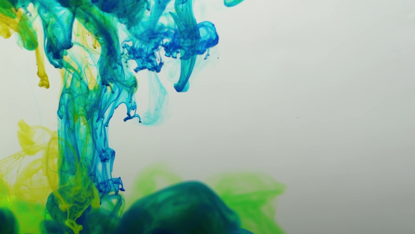 Colored paints are mixed in water. Bright abstract background. | Shutterstock HD Video #1097593049