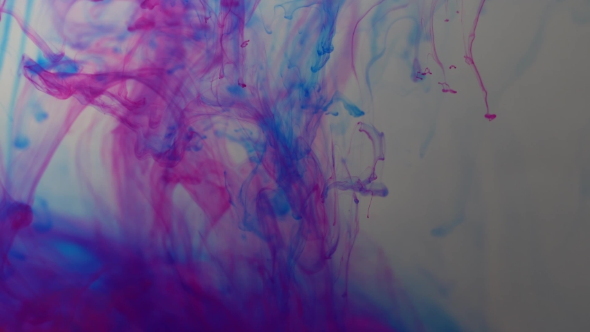 Colored paints are mixed in water. Bright abstract background. | Shutterstock HD Video #1097593057