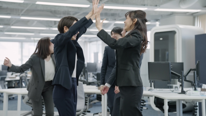 Asian businessmen high-fiving each other Royalty-Free Stock Footage #1097594719