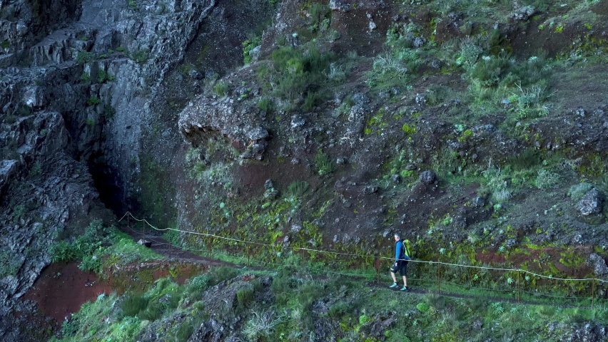 Video shooting between Pico do Arieiro and Pico Ruivo in Madeira. The highest peaks of the island. Trekking in the most beautiful trail in Europe. Sunrise and Sunset. Low clouds. Surreal environment.