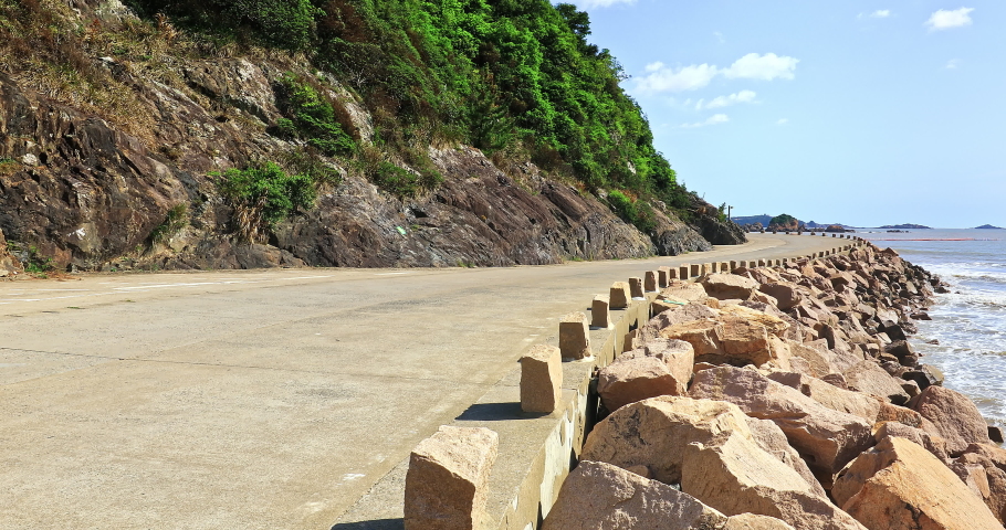 Empty cement road and mountain with sea natural scenery on a sunny day. 4K real time video. | Shutterstock HD Video #1097602879