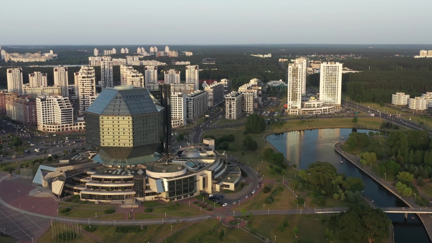 Top view of the National Library and the new microdistrict with a park in Minsk-the capital of the Republic of Belarus at sunset, a public building Royalty-Free Stock Footage #1097604493
