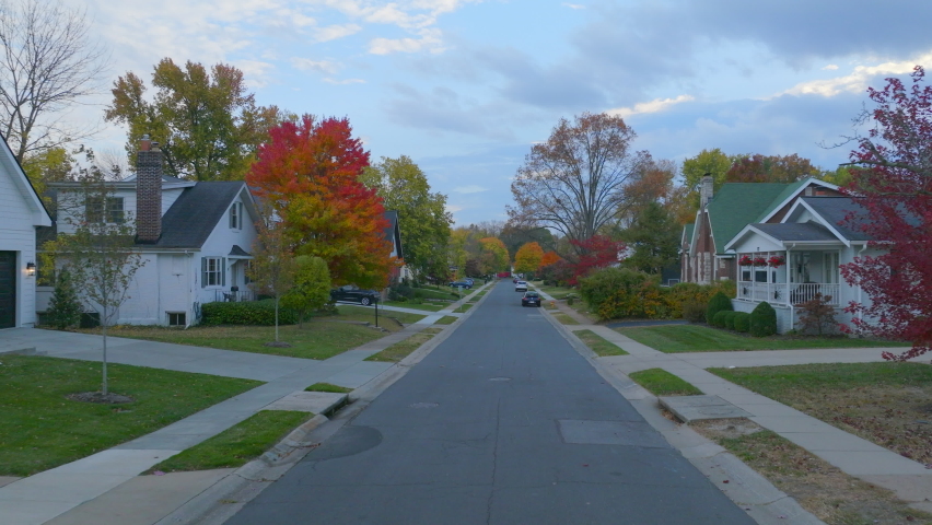Pull back down a surburban street in Autumn.