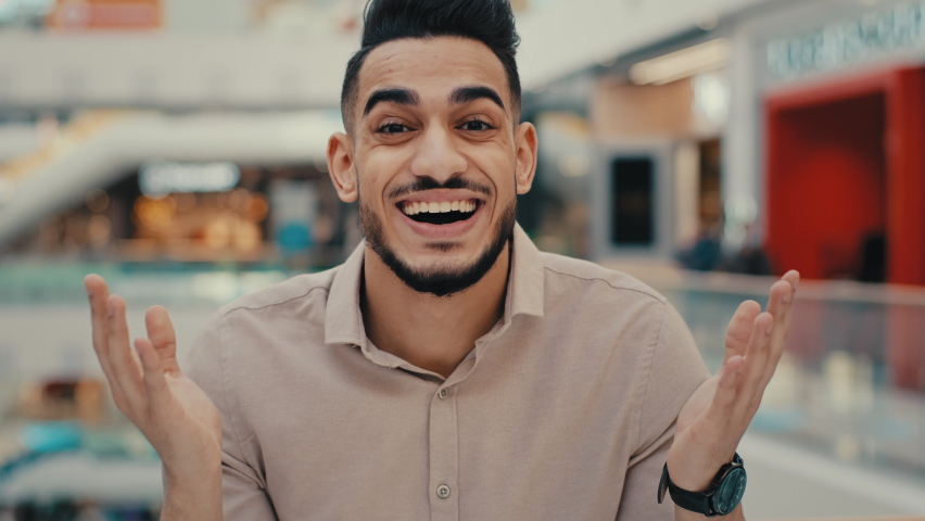 Indian Hispanic ethnic emotional man win face reaction shocked with business achieve achievement amaze guy male businessman amazement ecstatic looking at camera happy with victory euphoria winning Royalty-Free Stock Footage #1097615443