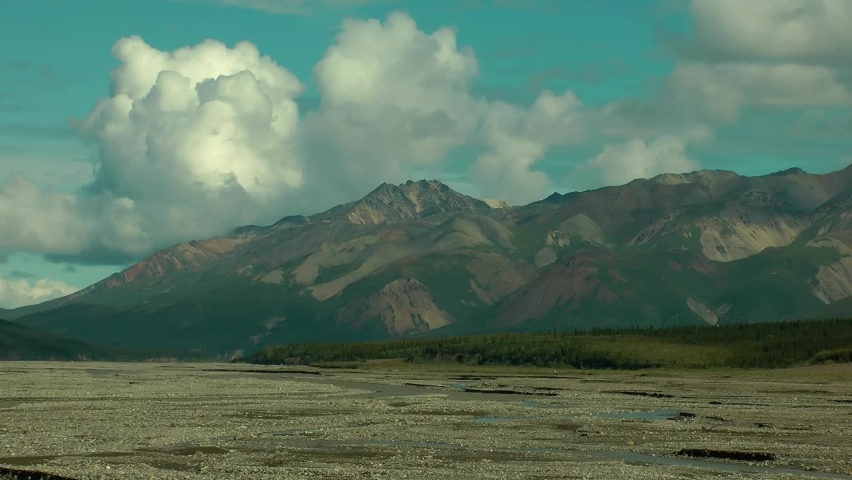 Denali National Park reserve, Mountains and clouds, Timelapse. Timelapse mode at sunset, Denali, Alaska 
