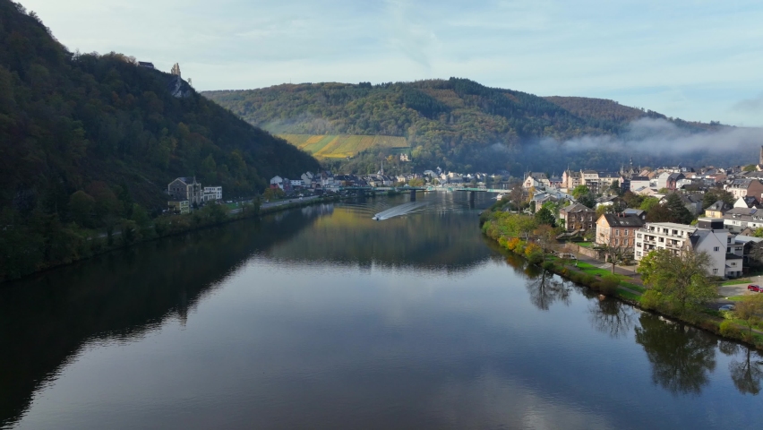 Aerial Drone Shot in autumn of Traben-Trarbach with Morning Fog. River Moselle in early fall, Germany. Moselland.