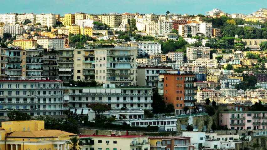 Aerial view of colour multistorey apartment houses in city. Accommodation in travel destination. Parallax effect. Naples, Italy | Shutterstock HD Video #1097622563