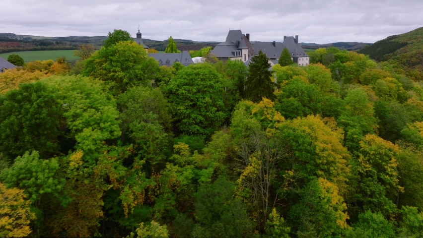 Wiltz, Luxembourg. Aerial shot at autumn of Wiltz Castle. Cloudy Weather Drone Footage