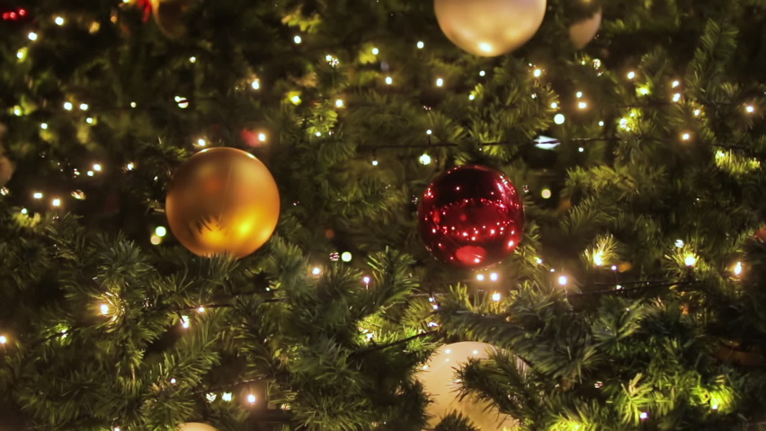Many ornaments and decorations on a beautiful decorated Christmas tree