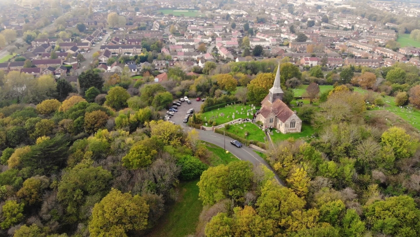 Aerial view of a small church on a hill in Basildon on a foggy day | Shutterstock HD Video #1097627339