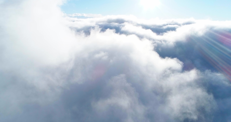 Amazing nature background flying in the clouds sky to the sun heaven Cinematic breathtaking aerial 4k clip | Shutterstock HD Video #1097628771