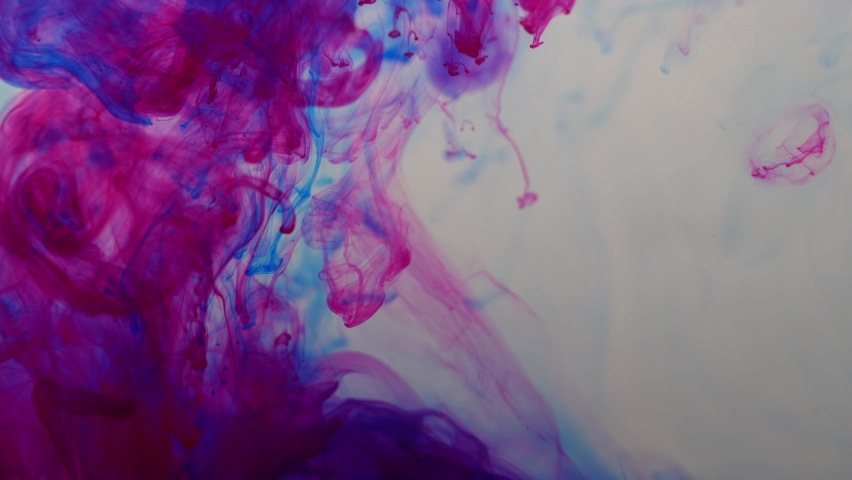 Colored paints are mixed in water. Bright abstract background. | Shutterstock HD Video #1097631719