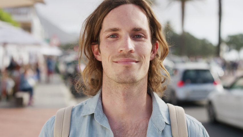 Travel, happy and face of a man in the city while on a summer vacation walking in the street. Happiness, tourism and portrait of young guy with freedom in a town on adventure on holiday in Australia. | Shutterstock HD Video #1097632289