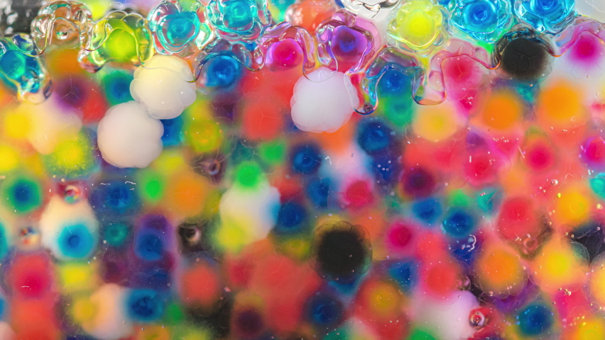 4K Time Lapse of Water beads growing in water close-up, abstract background. Texture of Hydrogel jelly balls - many colorful orbeez. | Shutterstock HD Video #1097634841