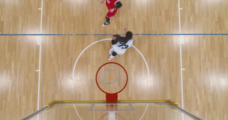 Women's basketball game, the confrontation of two team basketball players, active game, woman power, view from a height. Royalty-Free Stock Footage #1097634877