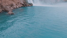 Beautiful turquoise lagoon in a tourist place. Waterfall. Harmony with nature. Pure water. Drone video 4k footage