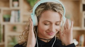 Radio, girl or student streaming music for relaxing, calm or zen mindfulness in university or college campus. Happy, face or portrait of woman in headphones dancing or dances to an audio on a break - Powered by Shutterstock - Get 15% off with code: PIKWIZARD15