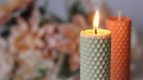 Beautiful handmade candles. A candle is burning. Cozy atmosphere in the house. Background video