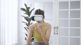 Caucasian woman enjoy playing virtual reality games, Healthy young woman wearing VR glasses exercising.