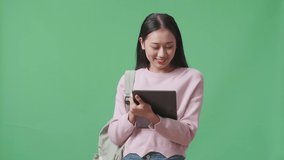 Asian Woman Student Using Tablet And Direct Fingers Side On Green Screen Studio
 - Powered by Shutterstock - Get 15% off with code: PIKWIZARD15