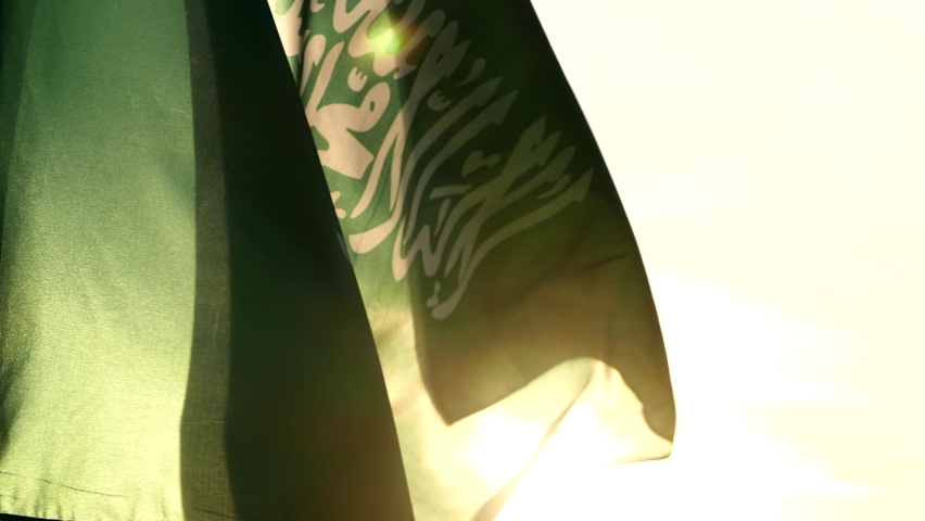 Saudi Arabia Flag, Close up Saudi Arabia national flag waving in the wind against sunset or sunrise, Slow Motion. Concept of Saudi Arabia, Flag, National, Independence Day, patriot, celebration
