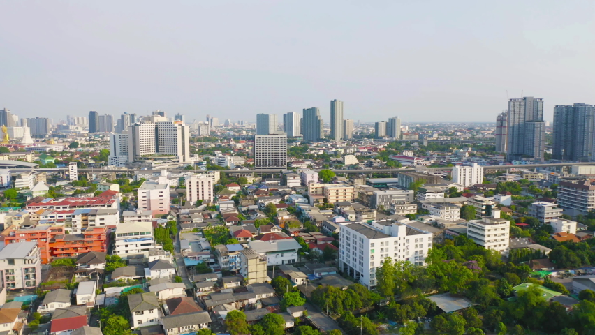 Aerial top view of residential buildings in Bangkok, Thailand. Urban city in Asia at noon. Landscape background.