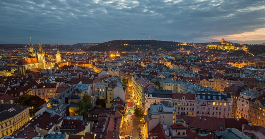 Prague Czechia Aerial v34 dusk to night hyperlapse birds eye view flyover old town square capturing culturally rich downtown cityscape with historical buildings - Shot with Mavic 3 Cine - October 2022 Royalty-Free Stock Footage #1097668091