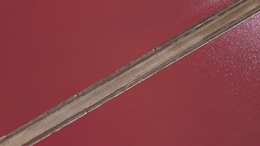 Aerial shot revealing a picturesque, hilly scenery around Lake Grassmere Saltworks