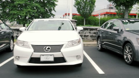 WARWICK, RI - JULY 28, 2015: Cars for sale at Lexus auto dealership lot on July 28, 2015. Lexus is the luxury vehicle division of Japanese automaker Toyota and is is sold in over 70 countries.