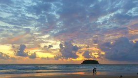 aerial view clouds are moving slowly in the sky during sunset at Kata beach Phuket.video 4K.
Nature video High quality footage. 
Scene of Colorful romantic sky sunset with cloud in the sky background.