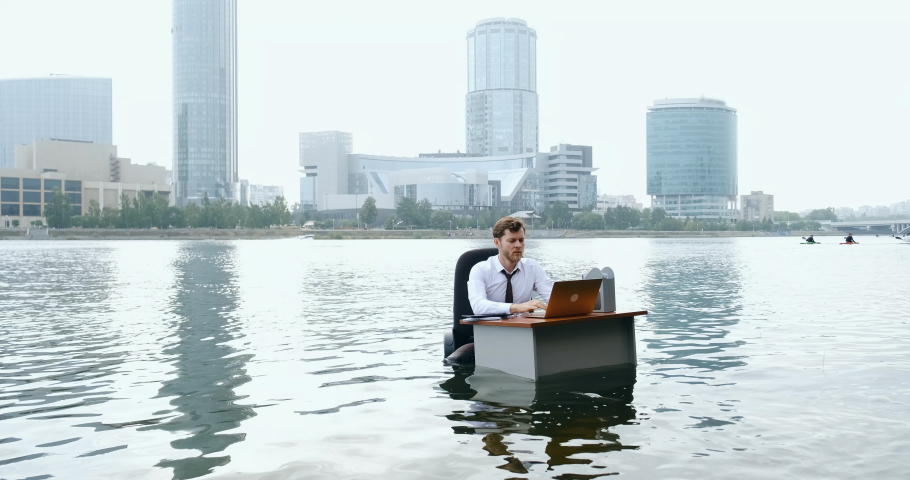 Employee manager businessman works in water. He escaped office, ran away, quit job. He is tired, feeling frustrated. Overworked crazy worker freelancer lost money. Concept of stress from office work. | Shutterstock HD Video #1097689261