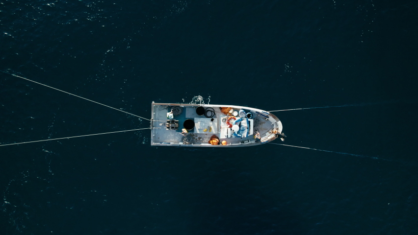 Top view of a blue boat sailing in the sea - Free HD Video Clips
